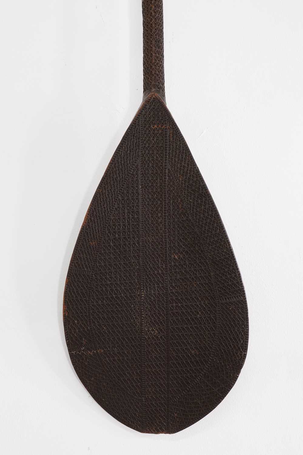Lot 300 - A carved hardwood paddle