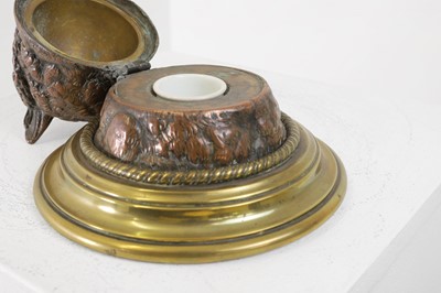 Lot 291 - A Victorian brass and copper cast inkwell