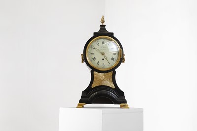 Lot 270 - A George III ebonised and brass-mounted balloon clock