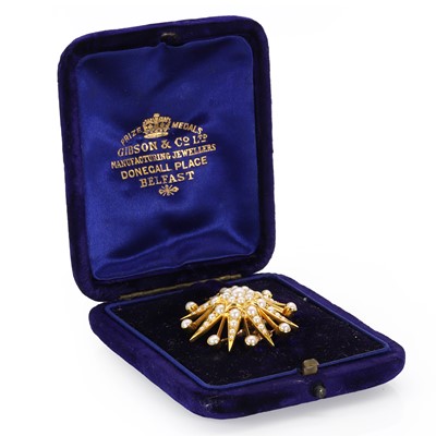 Lot 30 - An Edwardian gold and pearl starburst brooch