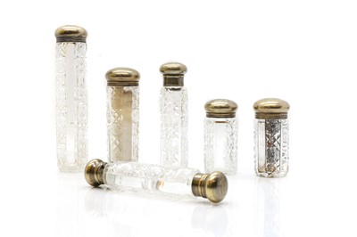 Lot 85 - A group of six cut glass and silver mounted bottles