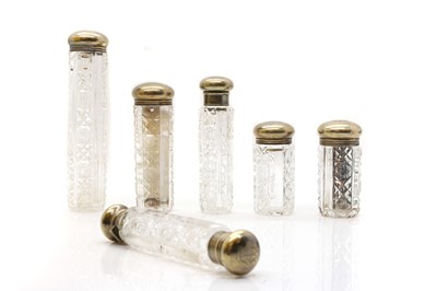 Lot 85 - A group of six cut glass and silver mounted bottles