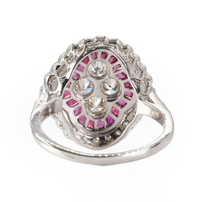 Lot 235 - A ruby and diamond quatrefoil cluster ring