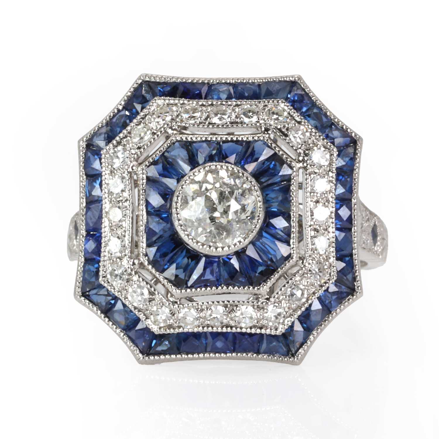 Lot 141 - An Art Deco style sapphire and diamond target cluster ring