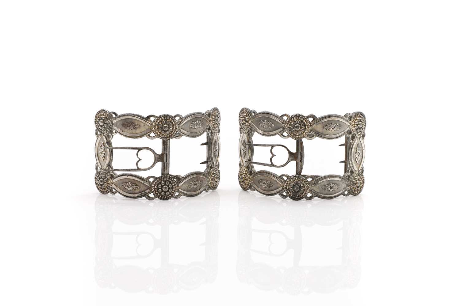 Lot 97 - A pair of bright-cut pewter shoe buckles