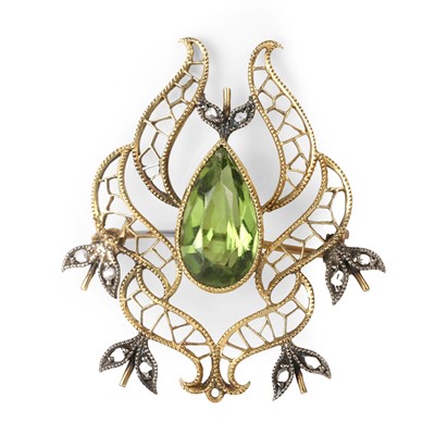 Lot 56 - An Edwardian peridot and diamond brooch/pendant