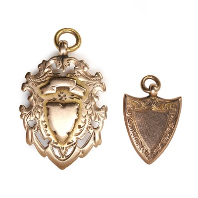 Lot 282 - Two 9ct gold shield pendants