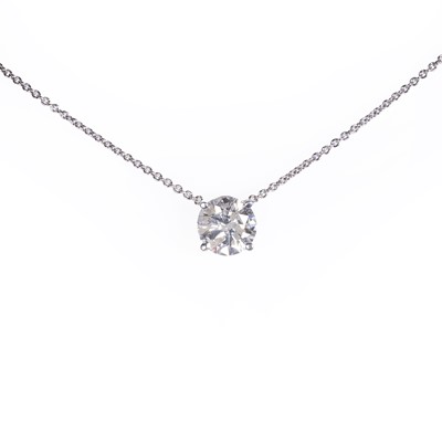 Lot 225 - A white gold diamond solitaire pendant and chain