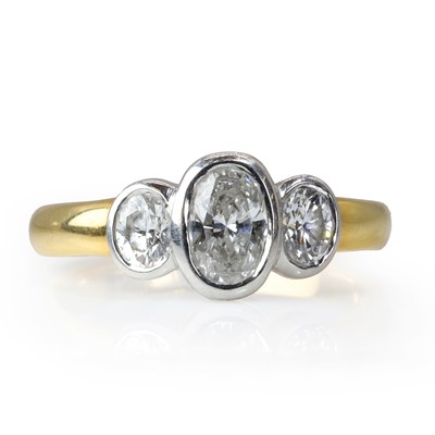 Lot 123 - An 18ct gold and oval cut diamond three stone ring