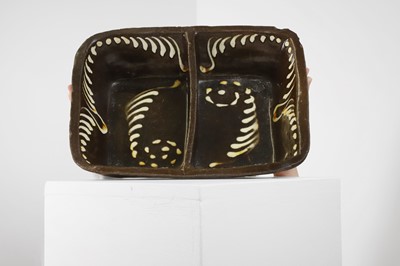 Lot 363 - A glazed earthenware slipware dish