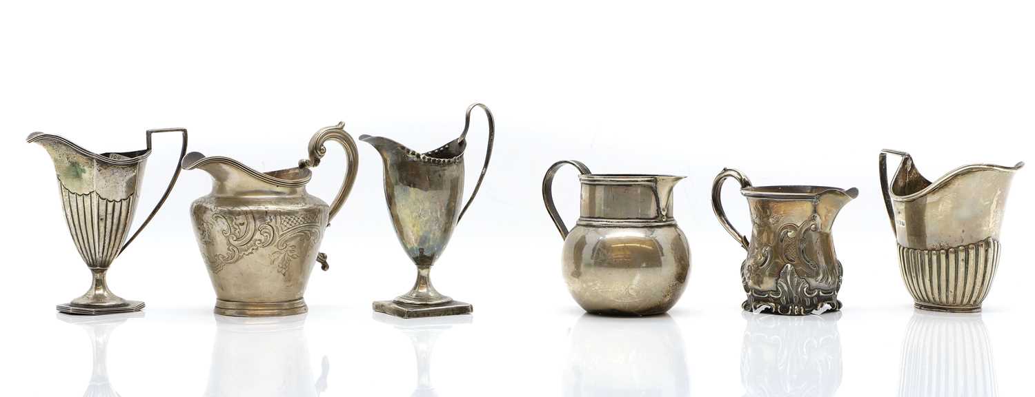 Lot 62 - A group of silver cream jugs