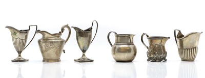 Lot 62 - A group of silver cream jugs