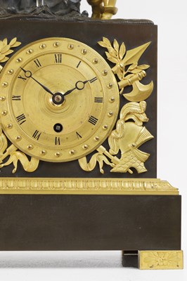 Lot An Empire-style patinated and gilt-bronze mantel clock
