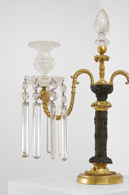 Lot A pair of George III-style patinated and gilt-bronze candelabra