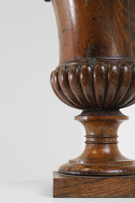 Lot 406 - A George III turned oak urn