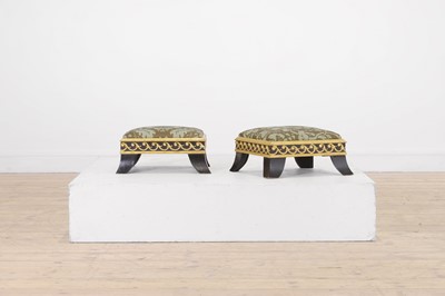 Lot 422 - A pair of small ebonised and parcel-gilt footstools