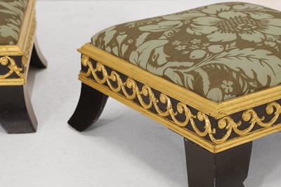 Lot 422 - A pair of small ebonised and parcel-gilt footstools