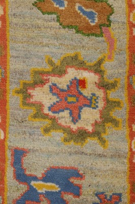 Lot 105 - An Oushak wool carpet