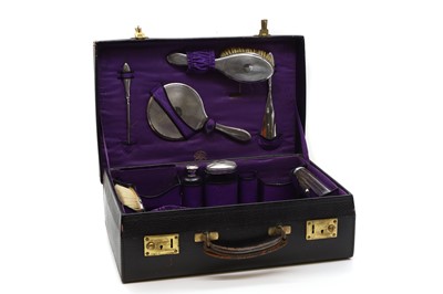 Lot 70A - A silver cased vanity set