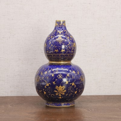 Lot 257 - A Chinese blue-glazed double gourd vase