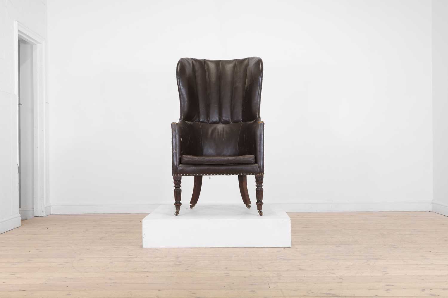 Lot 142 - A George IV mahogany barrel-back armchair
