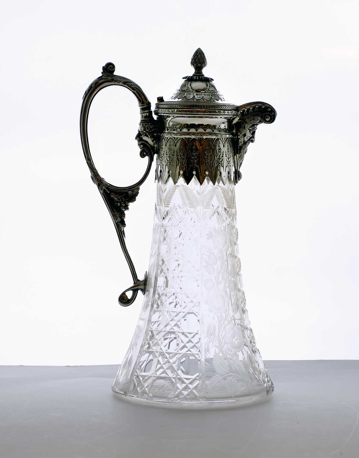 Lot 30 - A late Victorian silver and cut glass claret jug