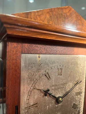 Lot 282 - A walnut library clock