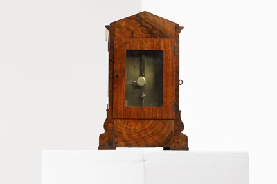 Lot 282 - A walnut library clock