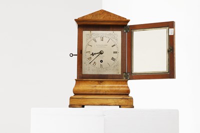 Lot 282 - A walnut library clock