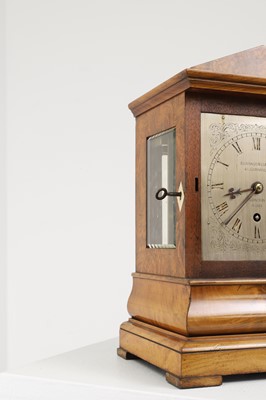 Lot 282 - A walnut library clock