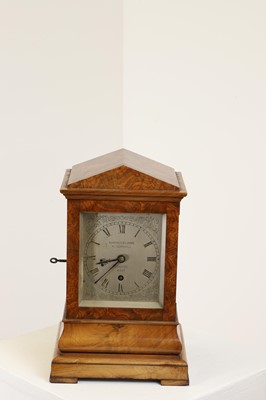 Lot 282 - A walnut library clock