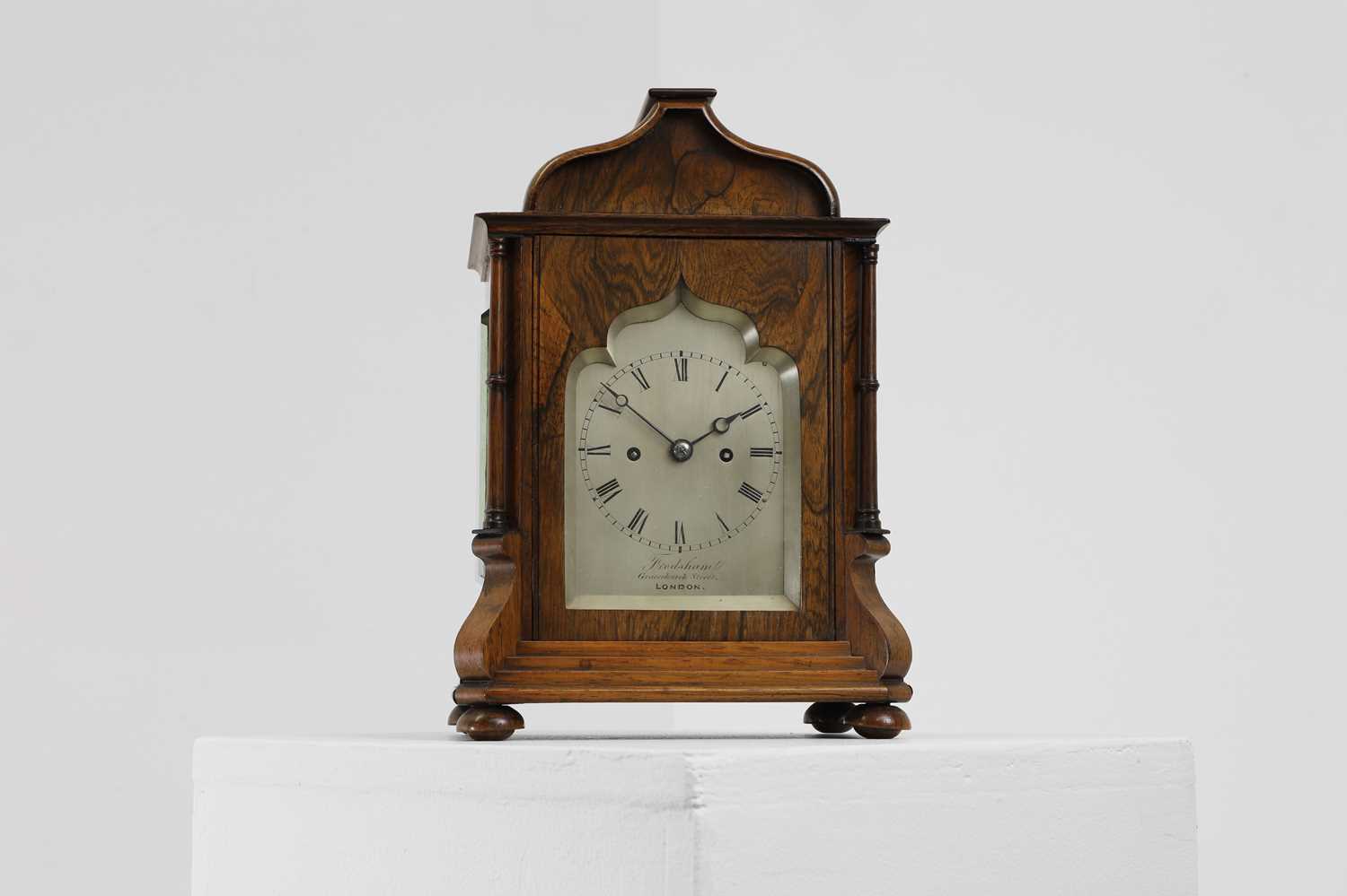 Lot 284 - A rosewood library clock,