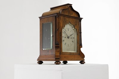 Lot 284 - A rosewood library clock
