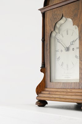 Lot 284 - A rosewood library clock