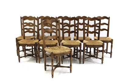 Lot 518 - A set of ten fruitwood chairs