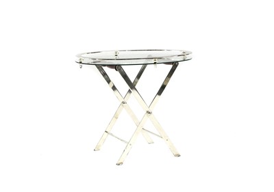 Lot 511 - A glass and metal coffee table