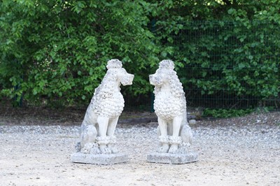 Lot 685 - A pair of composite stone poodles