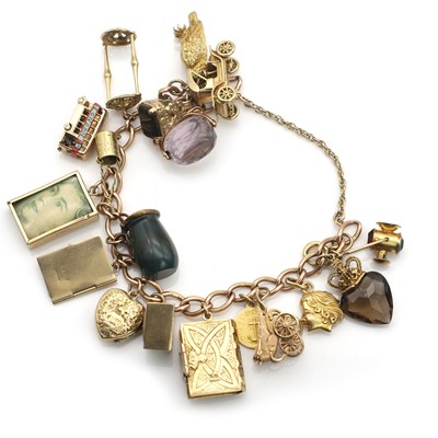 Lot 460 - A gold charm bracelet