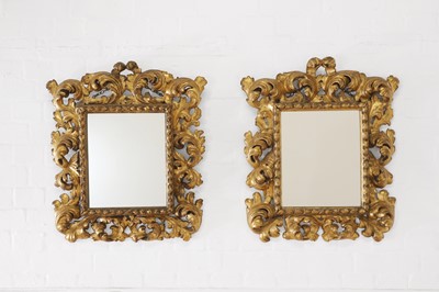 Lot 417 - A pair of carved giltwood mirrors