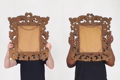 Lot 417 - A pair of carved giltwood mirrors