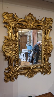 Lot 448 - A carved giltwood wall mirror