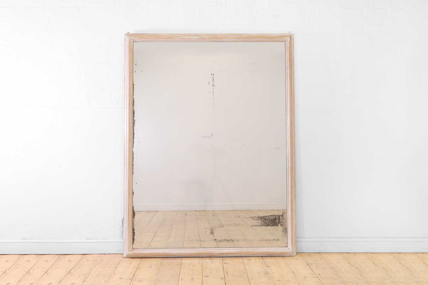 Lot 554 - A limewashed pine wall mirror