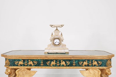 Lot 695 - An onyx and gilt-mounted mantel clock