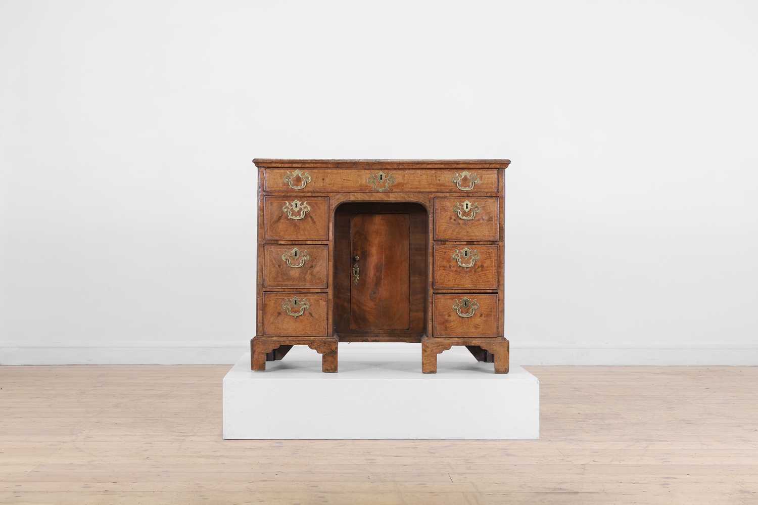 Lot 360 - A George II walnut kneehole desk