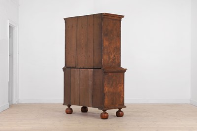 Lot 98 - A walnut cabinet on chest