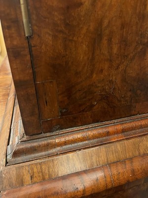 Lot 98 - A walnut cabinet on chest