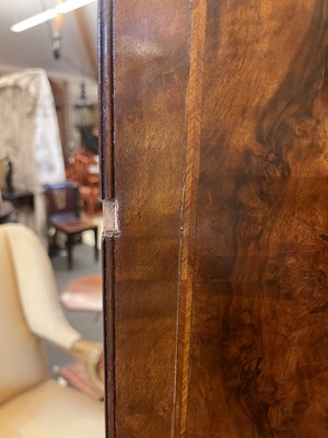 Lot 98 - A walnut cabinet on chest