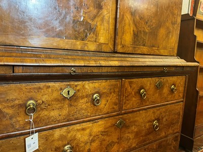 Lot 98 - A walnut cabinet on chest