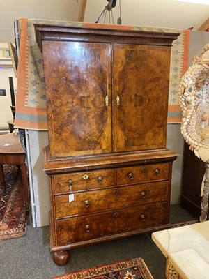 Lot 98 - A walnut cabinet on chest