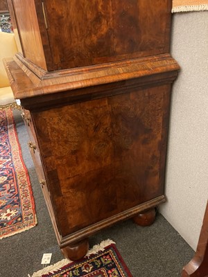 Lot 98 - A walnut cabinet on chest